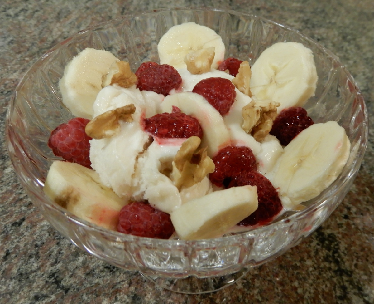 Aquafaba [{chickpea} bean water] ice cream with walnuts, raspberries, bananas and a desire for a treat.