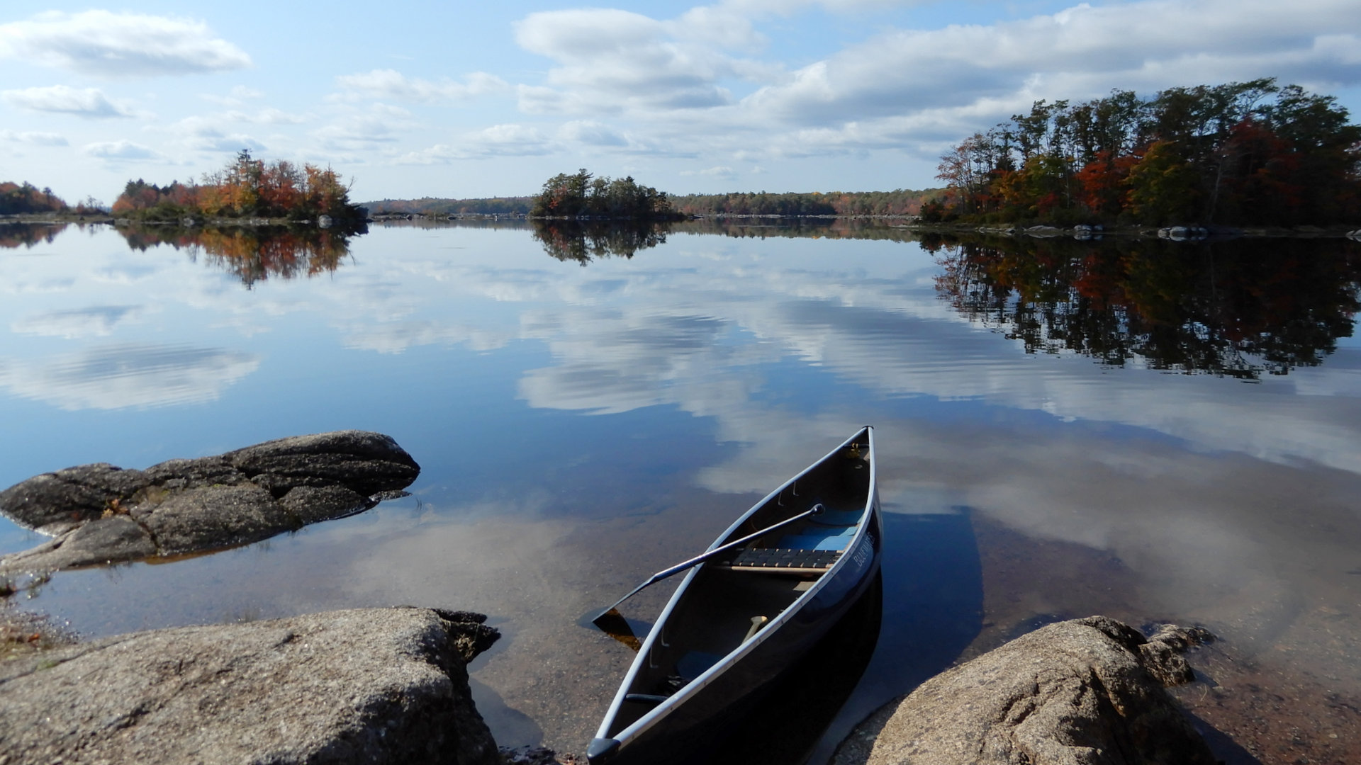 Gaspereau Lake, NS in fall stillness with a treasured Bluewater 16' 6" kevlar canoe and bent 8 gm carbon fibre paddle.